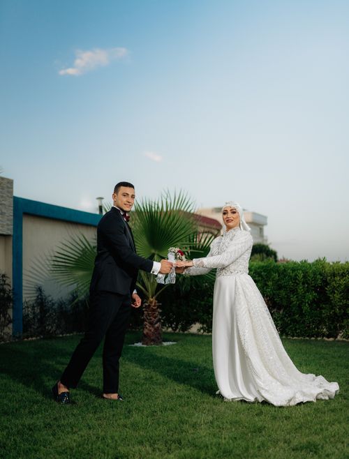 Free A beautiful couple poses on their wedding day in Béni Khiar, Tunisia. Stock Photo