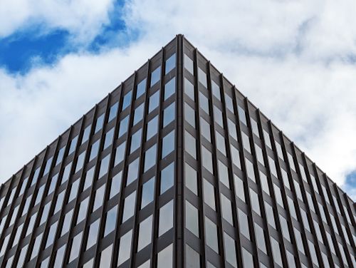 Free Low angle view of a modern office building in Halifax, NS against a blue sky with clouds. Stock Photo