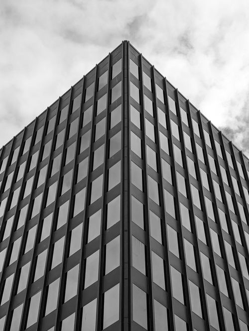 Free Striking low-angle view of a modern Halifax office building against a cloudy sky. Stock Photo