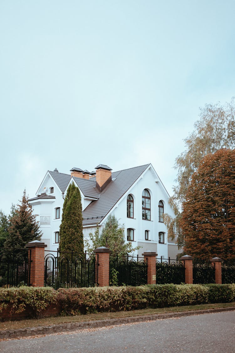 Fence And Mansion House Behind