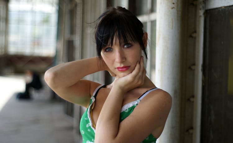 Woman Posing With Hands Around Neck