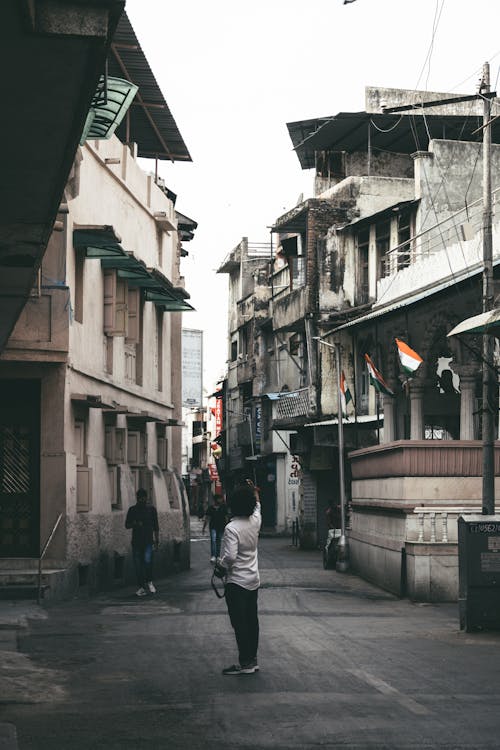 Man Standing in Alleyway