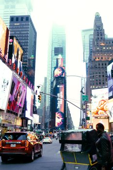 Captivating daytime view of Times Square filled with skyscrapers and bustling city life.