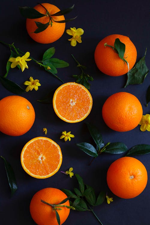 Tangerines among Flowers and Leaves