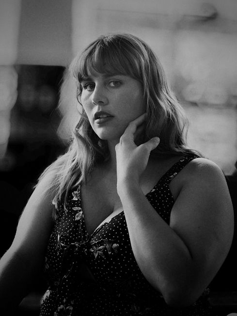 Artistic black and white portrait highlighting youthful elegance and expression.