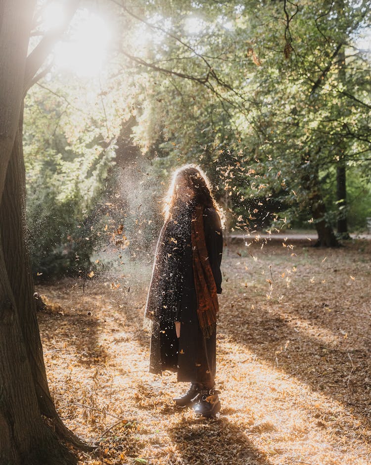 Woman In Autumn Coat In Park