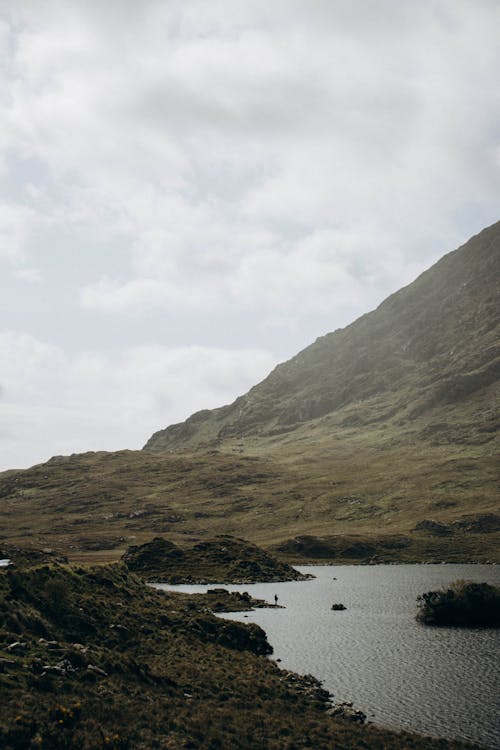 Landscape of a Hill and a Lake in a Fog