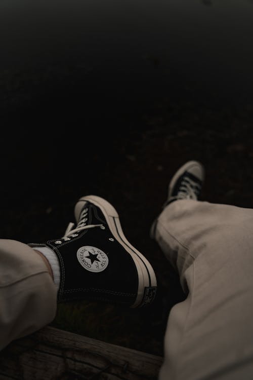 Shoes on Sitting Person Legs