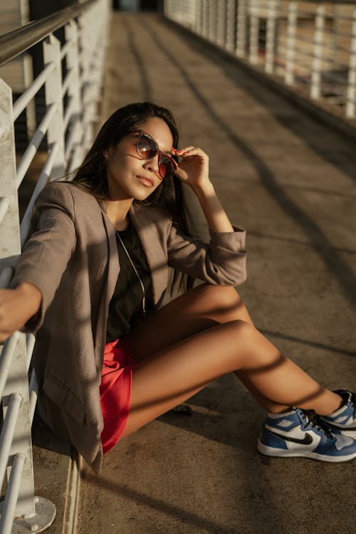 Brunette Woman Posing in Sunglasses and Jacket
