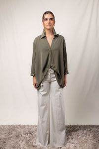 Woman in an oversized shirt and wide-leg trousers, photo by Mauricio Casas on Pexels