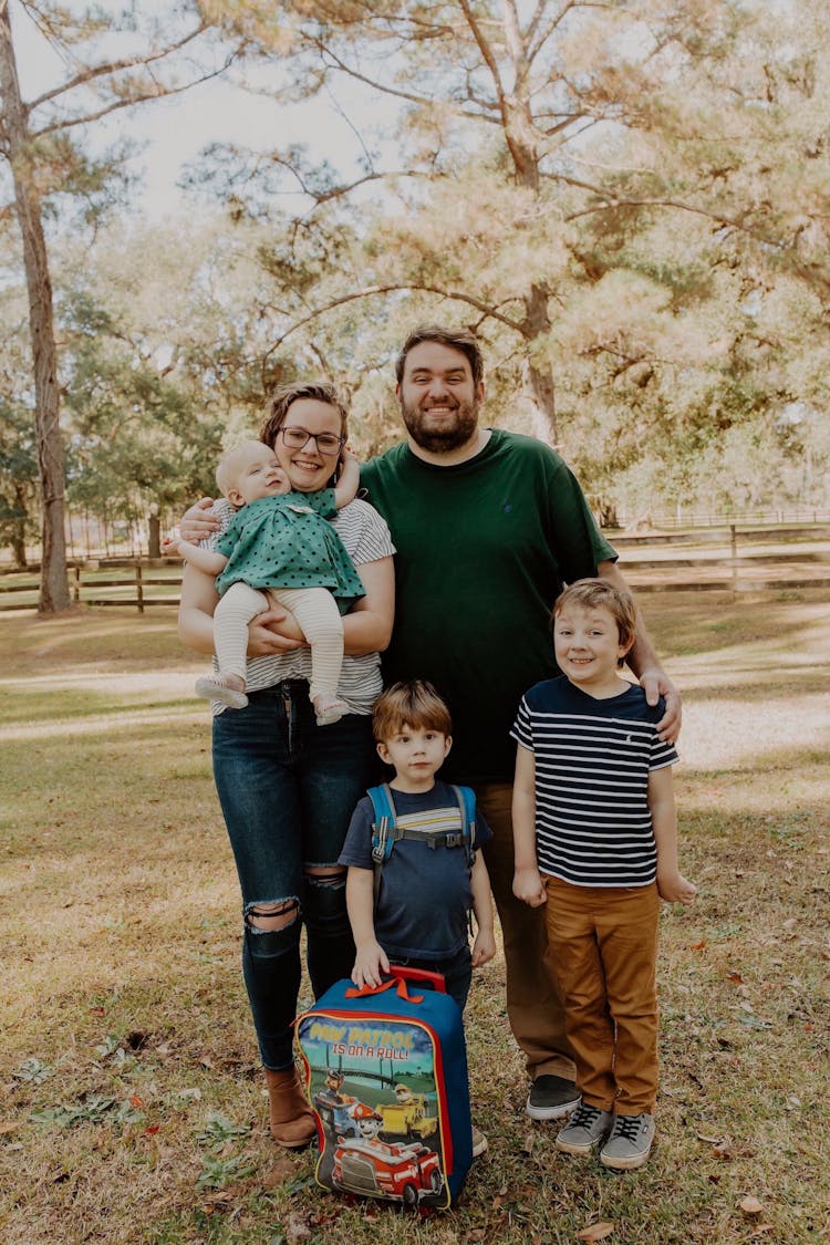 Smiling Family Posing With Children