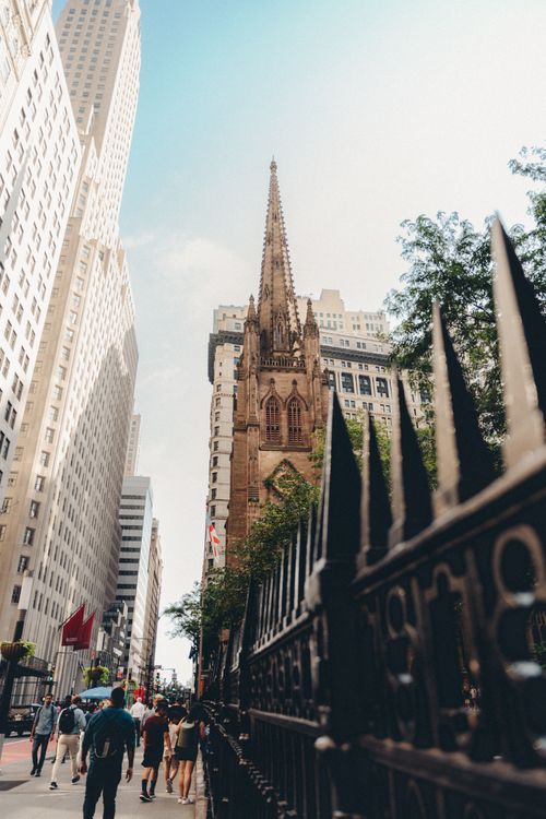 Free Capture of a New York street with a historic church and busy urban life Stock Photo