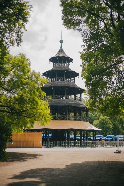 Free The iconic Chinesischer Turm in Munich surrounded by lush greenery, capturing a serene park atmosphere. Stock Photo