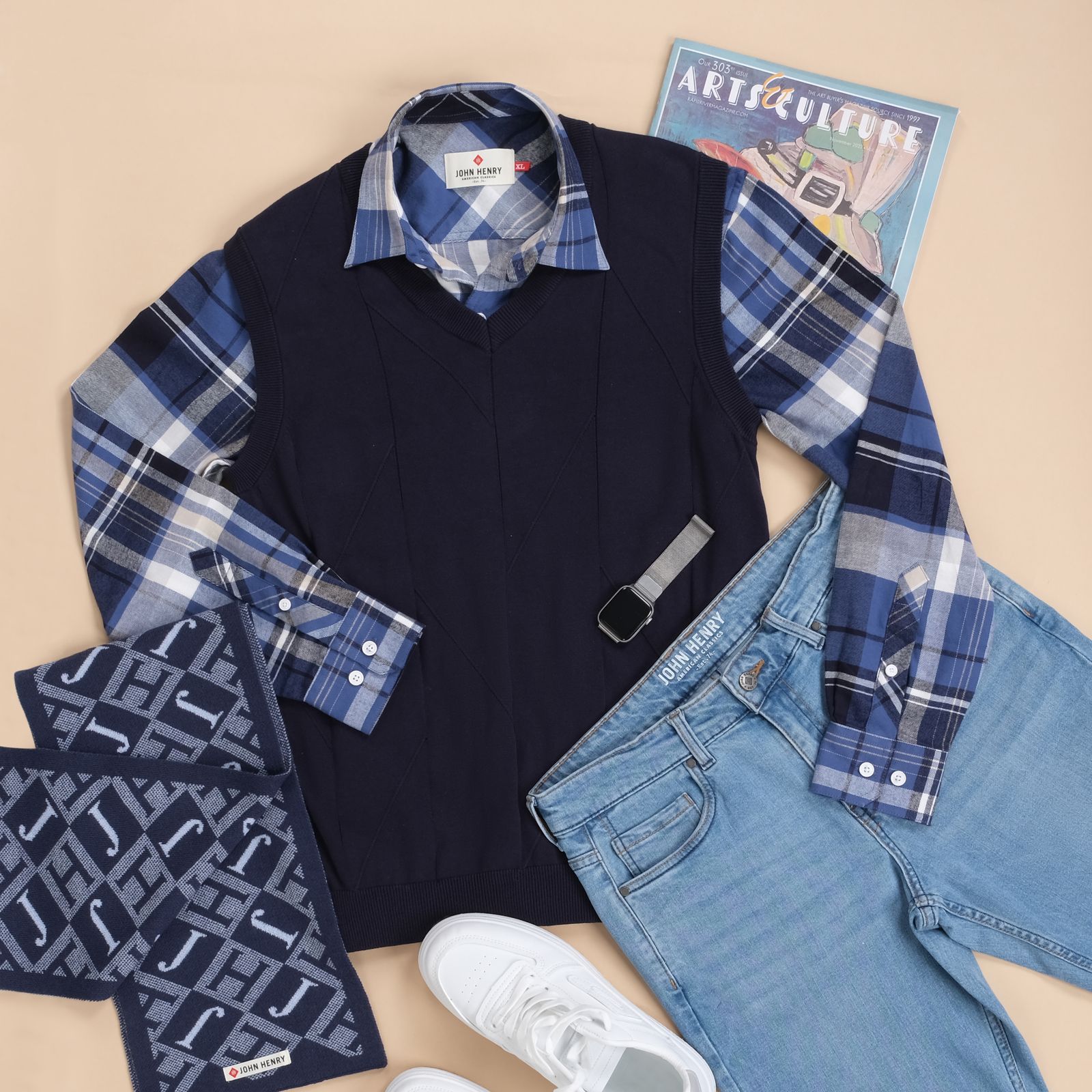 Casual shirt, denim and accessories arranged as a fashion flat lay without people