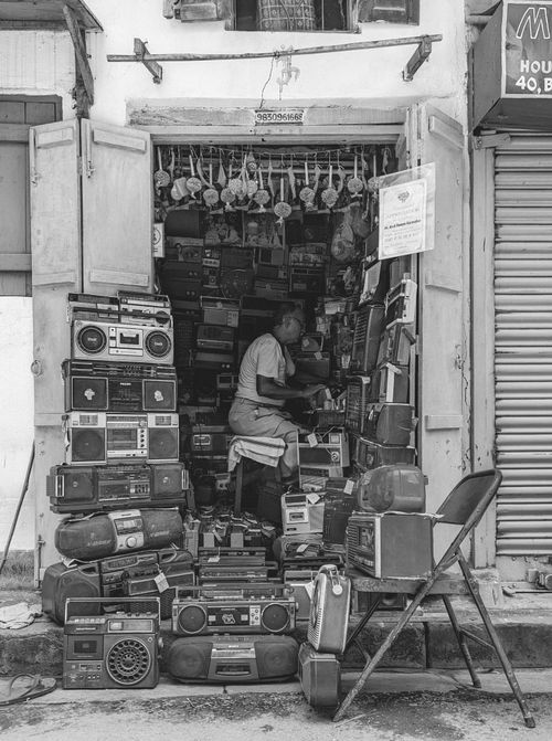Free Vintage radios and cassette players in a Kolkata street shop, India. Stock Photo