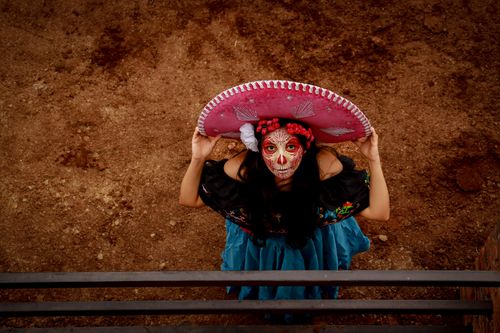 Free Woman in Day of the Dead attire with face paint and sombrero, San Bartolomé Xicomulco, CDMX. Stock Photo
