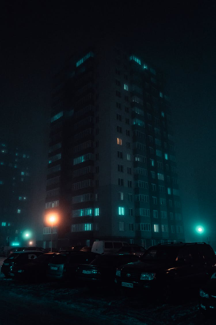 Car Parked Near Highrise Building