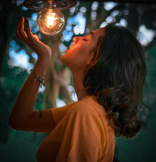 Free Selective Focus Photography of Woman Wearing Orange T-shirt Stock Photo