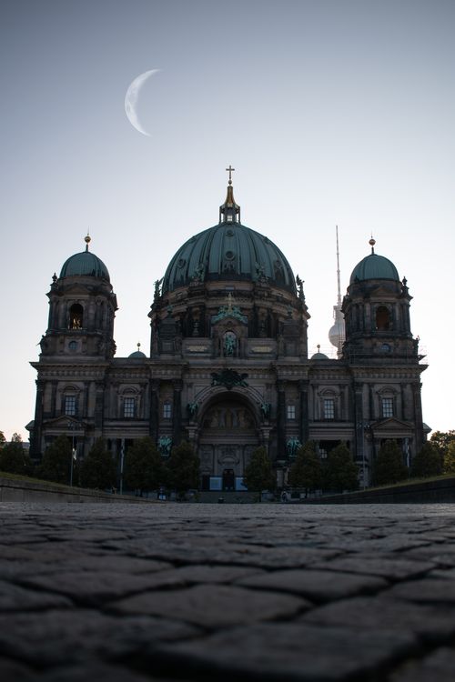 Free Beautiful shot of Berlin Cathedral with the moon and TV Tower in the background at twilight. Stock Photo