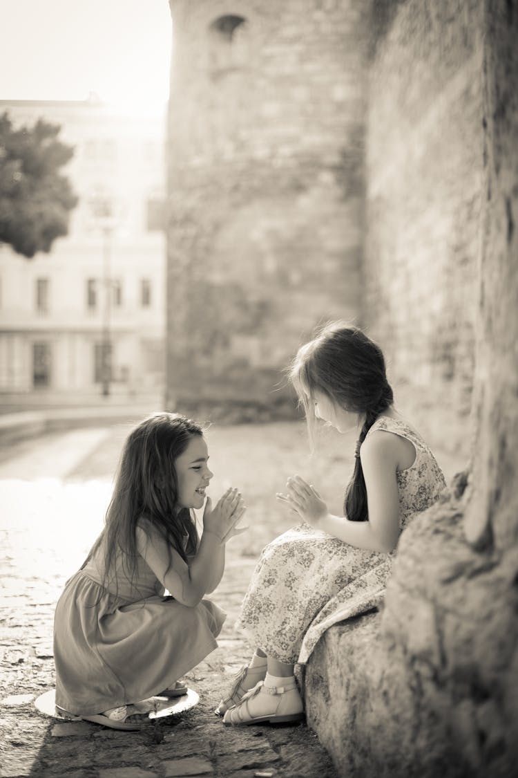 Two Girls Playing In The Street