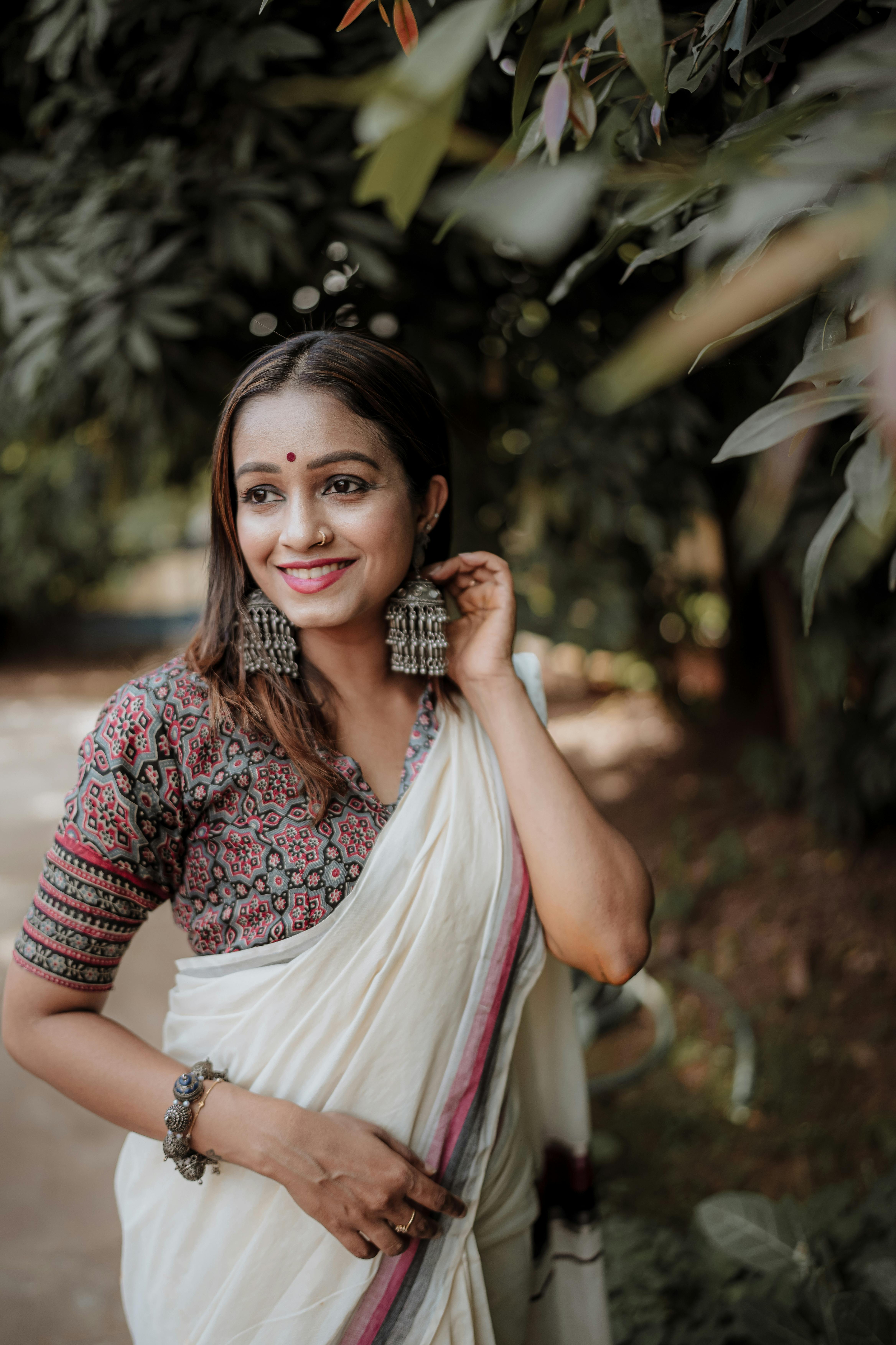 indian women in saree looking into camera long rebonding hair straight  black hair face toward camera