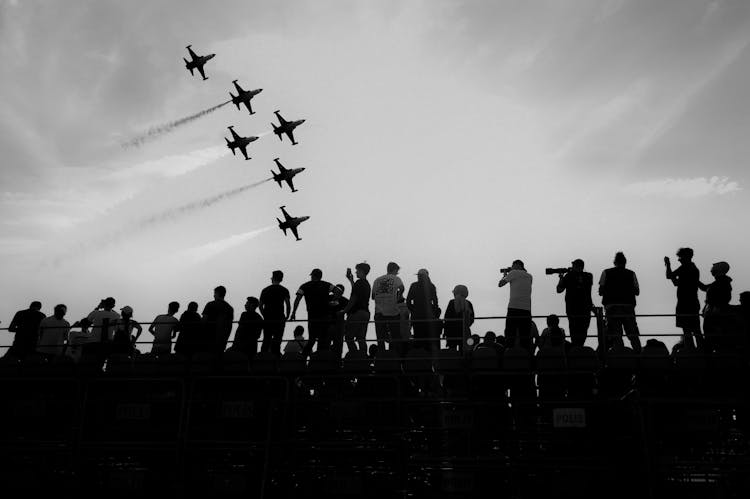 Squadron Of Planes Above The Audience At An Air Show