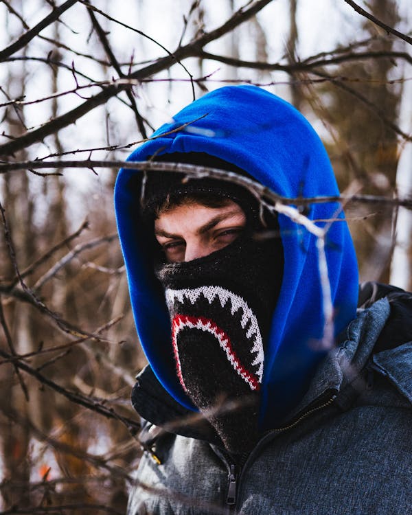 Man Wearing Hoodie Near Trees