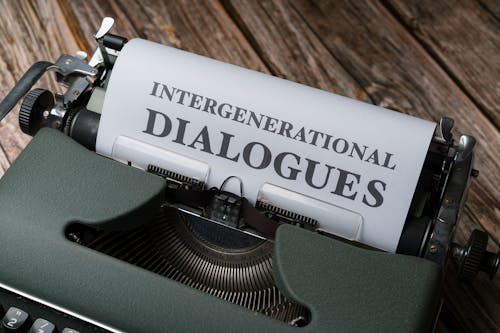 A typewriter with the words intergenerational dialogue on it
