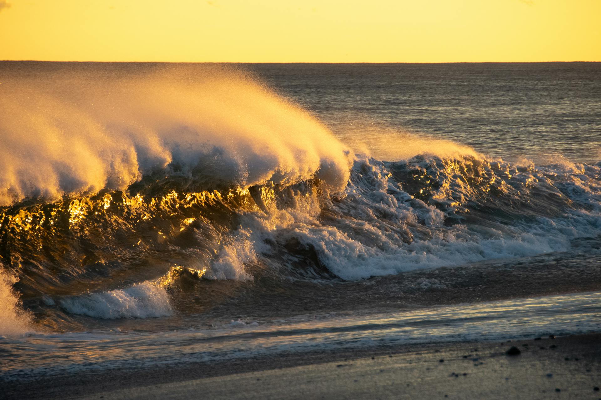 Captivating sunset over crashing waves at Westerly, Rhode Island beach.