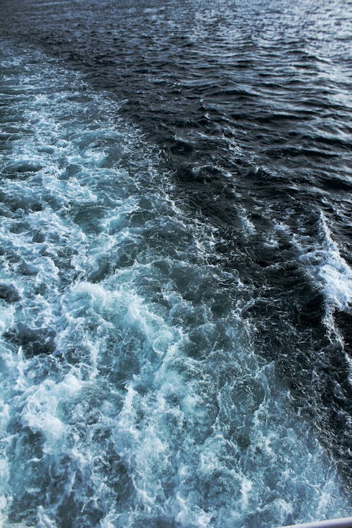 Wavy Water behind Sailing Vessel