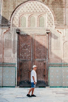 Explore the intricate designs of a historical entrance in Fes, Morocco.