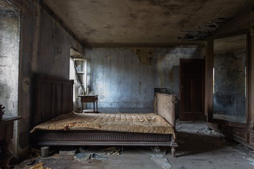 Free Empty Damaged Room With Mattress Stock Photo