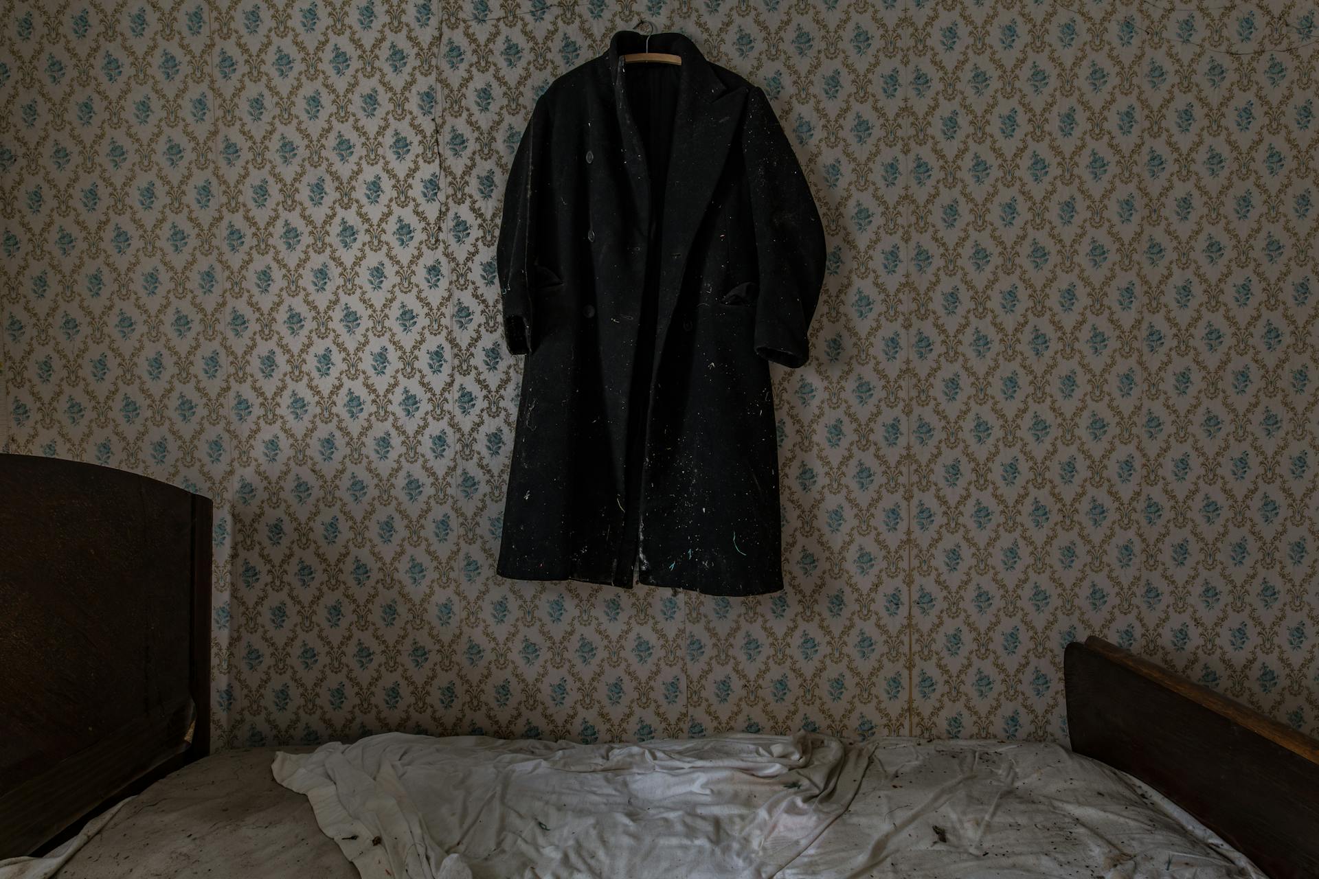 Black Coat Hanging on Wall