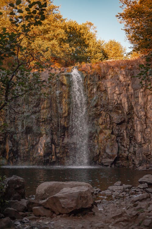 Waterfall on a Rocky Cliff