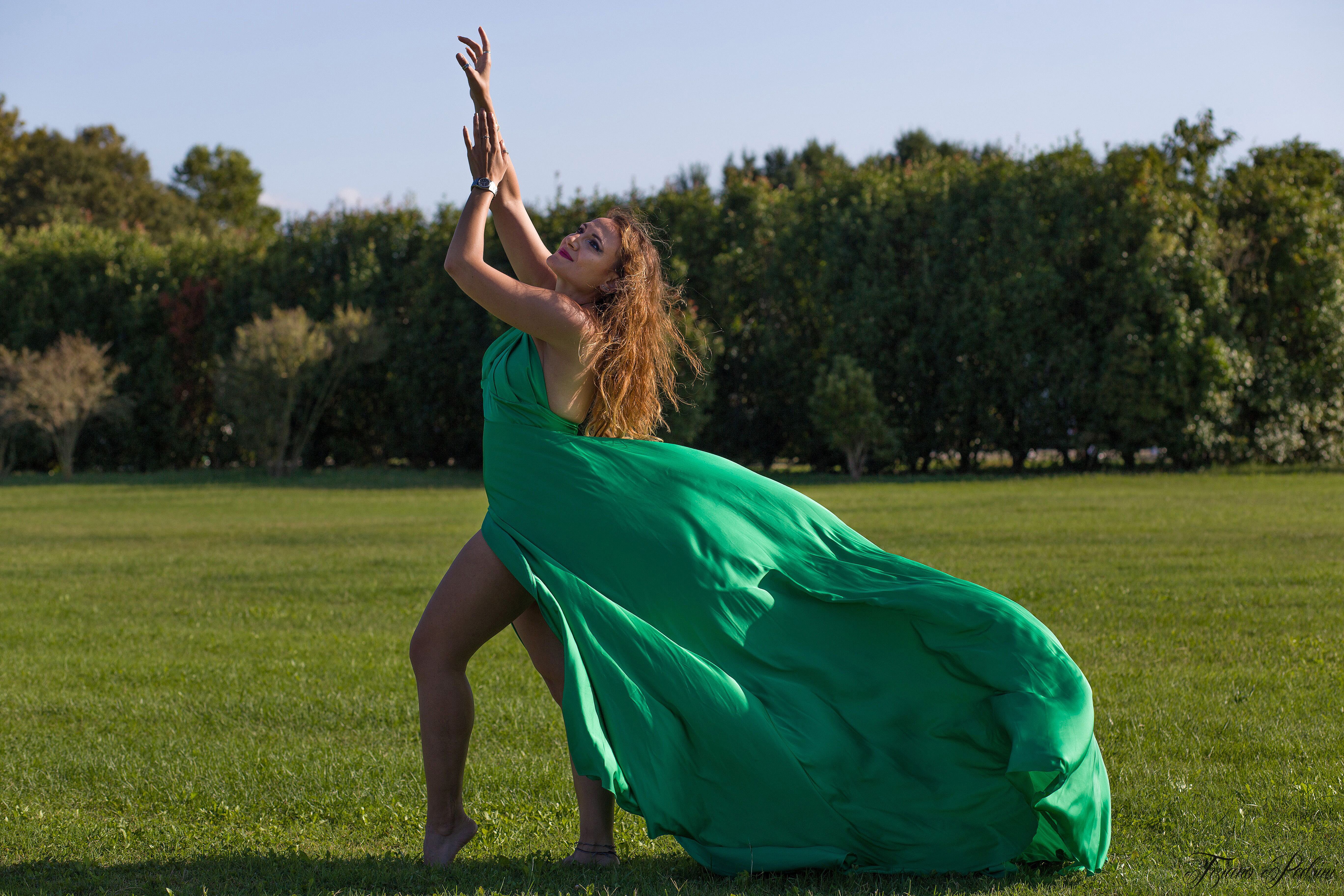 Woman Standing in Green Elegant Dress on Meadow · Free Stock Photo