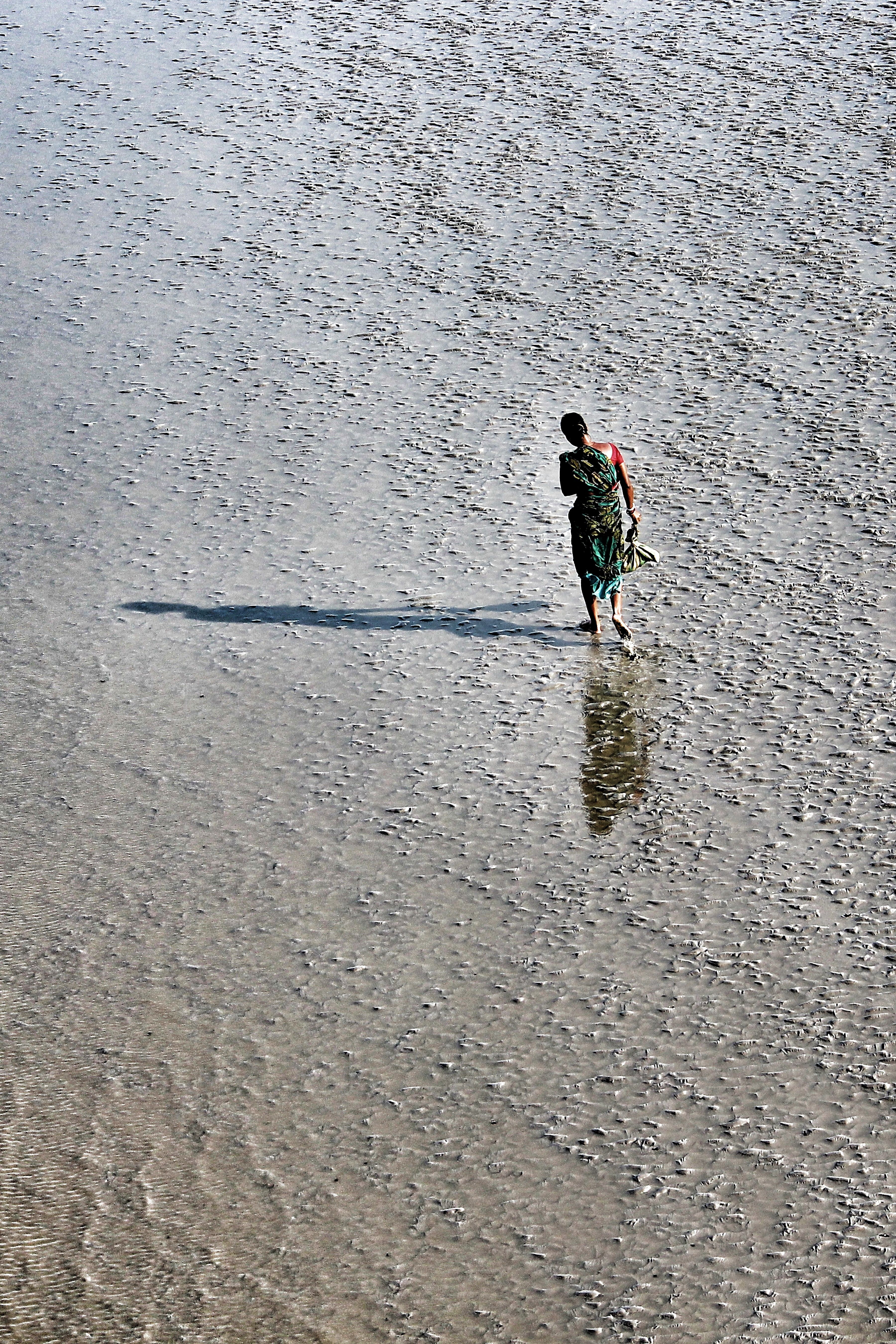 Aerial View of a Person Walking on a Beach · Free Stock Photo