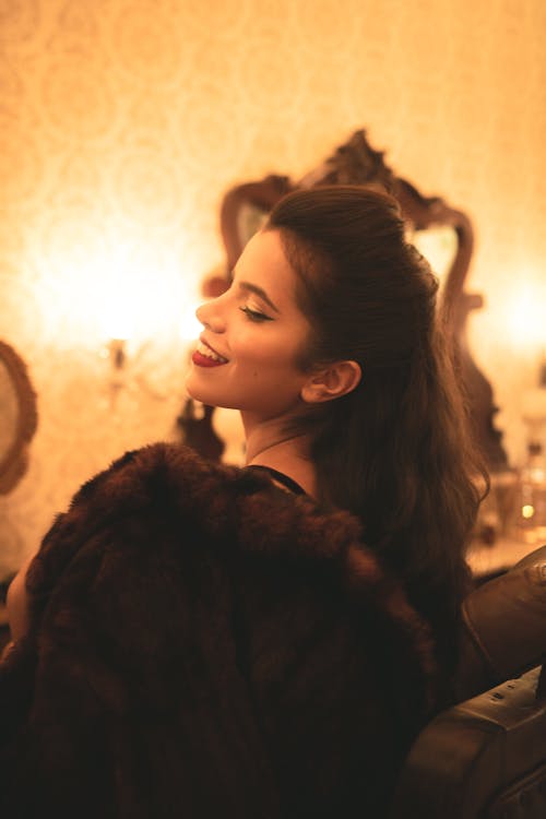 Side View Photo of Woman in Brown Fur Jacket Posing