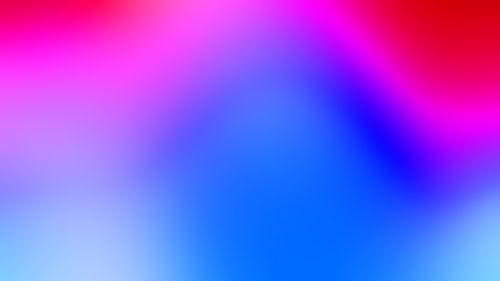 Free Bright and colorful gradient background with pink, blue, and red hues. Stock Photo
