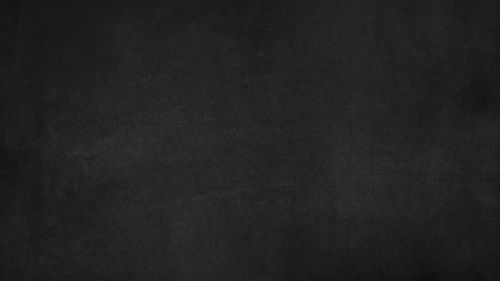 Free A high-resolution blank chalkboard texture, perfect for education-related designs and backgrounds. Stock Photo