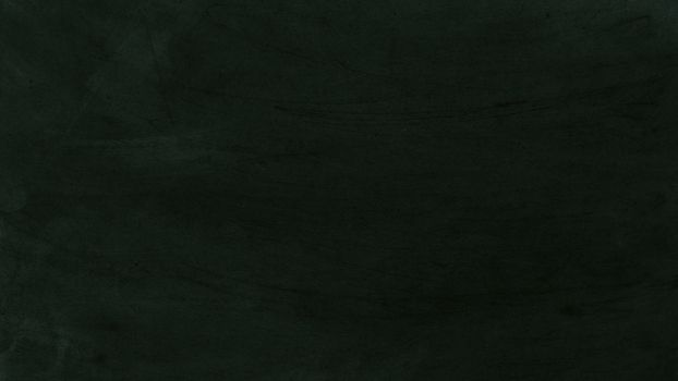 Black chalkboard texture with various chalk marks and scratches.