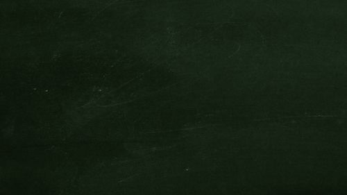 Free High-resolution dark green chalkboard texture perfect for educational or design projects. Stock Photo