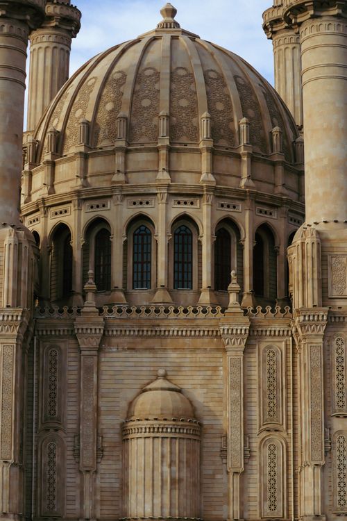 Free Elegant Ottoman architecture featuring a detailed mosque dome in a vertical shot. Stock Photo
