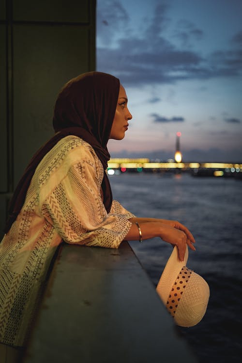 Woman in Hijab Standing on Sea Shore in Istanbul