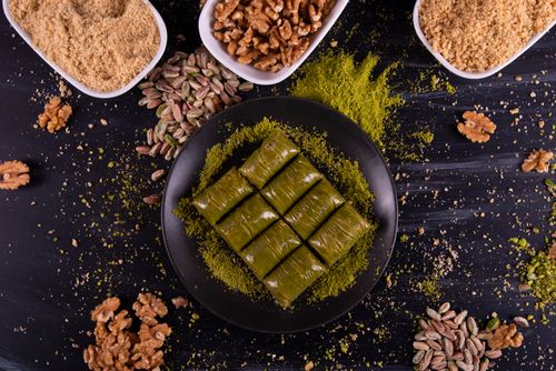 Free Top view of baklava with pistachios and walnuts, featuring a vibrant food display. Stock Photo