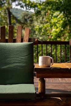 A cozy patio scene featuring a chair and a coffee mug, perfect for leisure moments outdoors.