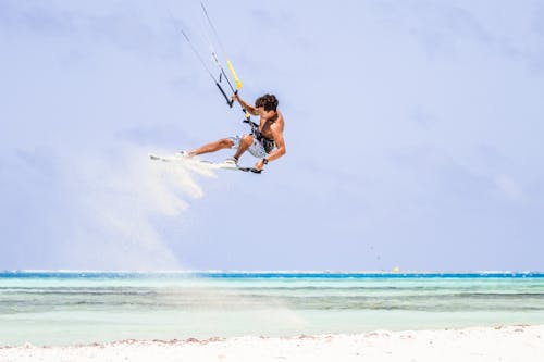 Kiteboarder Midair Over the Beach