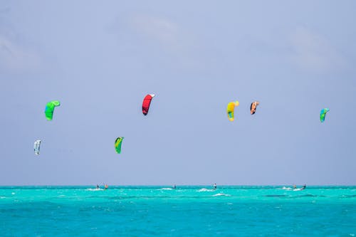 Group of Kiteboarders on the Turquoise Sea
