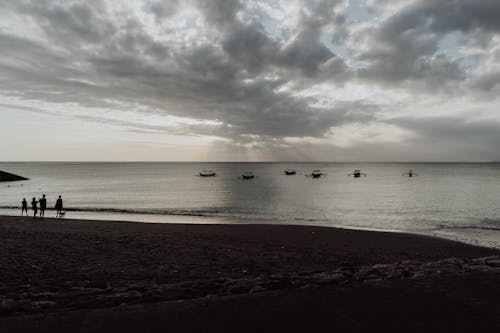 Small Catamarans in the Sea Near the Beach