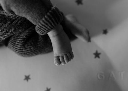 Free Baby Legs in Woolen Rompers Stock Photo