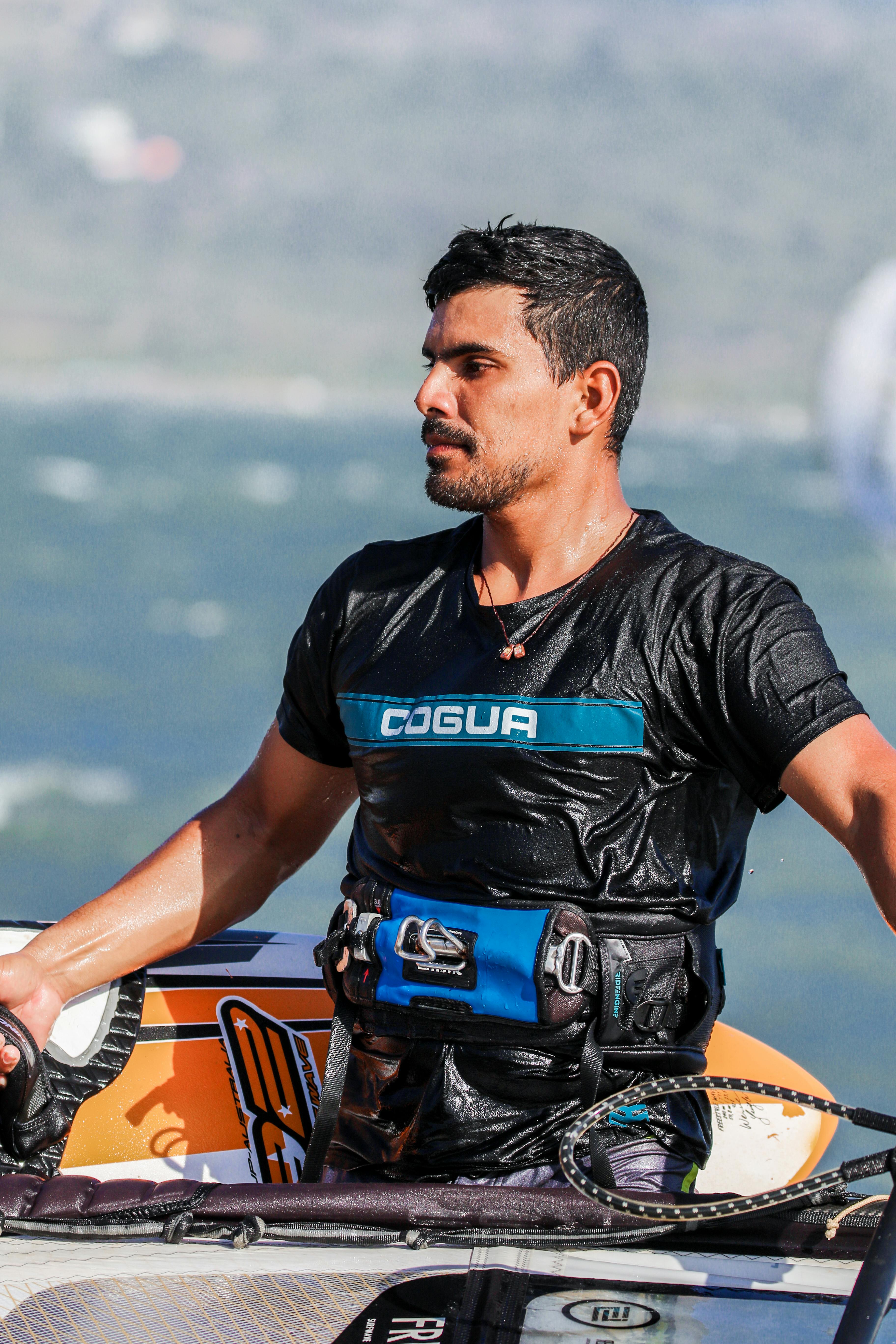 Man in Wet Black Water Sport Clothing · Free Stock Photo